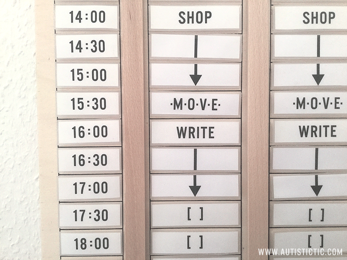 Close up of my planner showing the time in 30 minute increments and some signs I use. Arrows and lines to indicate how long a task is scheduled for and brackets to indicate break times.